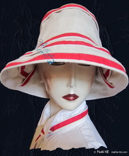 summerhat, sea wind, white sand and red linen 